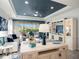 Bright living room showcasing a sleek entertainment center and a view of the screened outdoor living space at 10450 Highland Park Pl, Palmetto, FL 34221