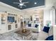 Open-concept living room with stylish decor and a clear view into the modern kitchen at 10450 Highland Park Pl, Palmetto, FL 34221
