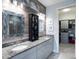 The main bathroom boasts a dual sink vanity, modern lighting, and adjacent walk-in closet at 10450 Highland Park Pl, Palmetto, FL 34221
