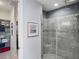 The primary bathroom features a spacious shower and adjacent walk-in closet with custom organization system at 10450 Highland Park Pl, Palmetto, FL 34221