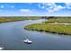 Aerial view of the river with small islands and boats in the river at 1134 Starfish Ln, Tarpon Springs, FL 34689