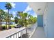 Relaxing balcony views of the neighborhood waterway, lush palm trees, and boat parking at 1134 Starfish Ln, Tarpon Springs, FL 34689