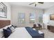 Bright bedroom featuring a cozy bed, ample natural light, and stylish decor for a serene retreat at 1134 Starfish Ln, Tarpon Springs, FL 34689