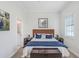 Bright bedroom with a cozy bed, wood furniture and a large window for natural light at 1134 Starfish Ln, Tarpon Springs, FL 34689