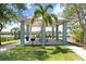 Community gazebo with seating by the water, ideal for relaxing and enjoying the outdoors at 1134 Starfish Ln, Tarpon Springs, FL 34689
