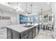 Open kitchen layout with large island, modern appliances, and an adjacent living area at 1134 Starfish Ln, Tarpon Springs, FL 34689