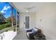 Inviting patio featuring cozy chair and peaceful surroundings, perfect for unwinding at 1134 Starfish Ln, Tarpon Springs, FL 34689