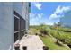 Charming outdoor patio area ideal for relaxing, overlooking well-maintained greenery at 1134 Starfish Ln, Tarpon Springs, FL 34689