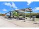 Shaded picnic area with multiple tables and trash cans at 1134 Starfish Ln, Tarpon Springs, FL 34689