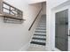 Unique staircase with beautiful patterned tiles and modern decor at 1134 Starfish Ln, Tarpon Springs, FL 34689