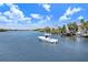 Beautiful water view of boats on the river with waterfront neighborhood in the background at 1134 Starfish Ln, Tarpon Springs, FL 34689