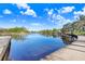 Beautiful waterfront view with a concrete walkway along the waterfront at 1134 Starfish Ln, Tarpon Springs, FL 34689