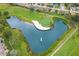 Breathtaking aerial view of the golf course's water hazard and sand trap at 11752 Wayside Willow Ct, Hudson, FL 34667