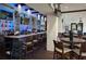 The community bar with plenty of seating and TVs for entertainment at 11752 Wayside Willow Ct, Hudson, FL 34667