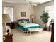 Cozy bedroom featuring a comfortable bed, ample natural light, and traditional decor at 11752 Wayside Willow Ct, Hudson, FL 34667
