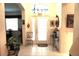 Warm and welcoming tiled foyer featuring high ceilings and decorative accents at 11752 Wayside Willow Ct, Hudson, FL 34667