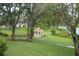 Beautifully landscaped park area with gazebo and walkway at 11752 Wayside Willow Ct, Hudson, FL 34667