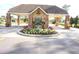 Professionally landscaped entrance to the community with guard house at 11752 Wayside Willow Ct, Hudson, FL 34667
