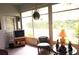 Bright sunroom with large windows offering serene outdoor views at 11752 Wayside Willow Ct, Hudson, FL 34667