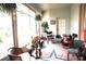 Charming sunroom with large windows and comfortable seating at 11752 Wayside Willow Ct, Hudson, FL 34667