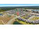 Wide aerial view of a new construction neighborhood featuring community pool, playground, and ponds at 12908 Hawkstone Trail Blvd, Lithia, FL 33547