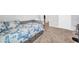 Comfortable bedroom with a twin bed featuring stylish bedding and plenty of natural light at 12908 Hawkstone Trail Blvd, Lithia, FL 33547