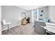 Well-lit bedroom featuring a desk, bed, and natural light from the window at 12908 Hawkstone Trail Blvd, Lithia, FL 33547