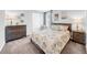 Cozy bedroom with a comfortable bed, dresser and stylish decor creating a relaxing retreat at 12908 Hawkstone Trail Blvd, Lithia, FL 33547