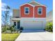 Charming two-story home with attached two-car garage, landscaped front yard and colorful exterior at 12908 Hawkstone Trail Blvd, Lithia, FL 33547