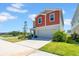 Exterior view of a modern two-story home with a driveway, attached garage and landscaping at 12908 Hawkstone Trail Blvd, Lithia, FL 33547