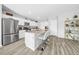 Modern kitchen with stainless steel appliances, spacious island, and sleek countertops at 12908 Hawkstone Trail Blvd, Lithia, FL 33547