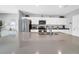 Spacious kitchen island is the centerpiece, complemented by stainless steel appliances and abundant white cabinets for storage at 12908 Hawkstone Trail Blvd, Lithia, FL 33547