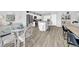 Open-concept kitchen with an island and bar seating, seamlessly connects to the dining area for easy entertaining at 12908 Hawkstone Trail Blvd, Lithia, FL 33547