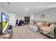 Spacious living room with ample seating, shelving and bright natural light at 12908 Hawkstone Trail Blvd, Lithia, FL 33547