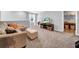 Cozy living room with a comfortable sofa and ottoman, perfect for relaxing and entertaining at 12908 Hawkstone Trail Blvd, Lithia, FL 33547