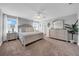 Spacious main bedroom with neutral tones, plush carpet, and abundant natural light at 12908 Hawkstone Trail Blvd, Lithia, FL 33547