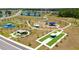 Overhead view of a park featuring tennis courts, playgrounds, shaded areas and landscaped walkways at 12908 Hawkstone Trail Blvd, Lithia, FL 33547