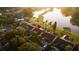 Aerial view of homes near a pond with manicured lawns showcasing the serene neighborhood at 12918 Royal George Ave, Odessa, FL 33556