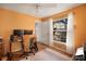 Bright bedroom with wood floors, a large window, and neutral decor at 12918 Royal George Ave, Odessa, FL 33556