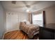 Comfortable bedroom with hardwood floors, closet space, and natural light at 12918 Royal George Ave, Odessa, FL 33556