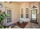 Charming entrance featuring dual doors, decorative windows, and a welcoming entryway at 12918 Royal George Ave, Odessa, FL 33556
