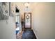 Inviting foyer with a decorative glass door, neutral walls, and stylish accents at 12918 Royal George Ave, Odessa, FL 33556