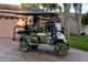 Golf cart with custom wheels and seats parked outside the house at 12918 Royal George Ave, Odessa, FL 33556