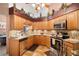 Well-equipped kitchen features stainless steel appliances, ample countertop space, and plenty of storage at 12918 Royal George Ave, Odessa, FL 33556
