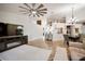 Bright, open-concept living room featuring hardwood floors and modern decor throughout at 12918 Royal George Ave, Odessa, FL 33556