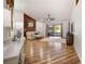 Bright living room with wood floors, a ceiling fan, and sliding doors to the lanai at 12918 Royal George Ave, Odessa, FL 33556