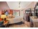 Spacious main bedroom features ample natural light, hardwood floors, and a relaxing, stylish atmosphere at 12918 Royal George Ave, Odessa, FL 33556
