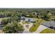 Beautiful home featuring a circular driveway, lush landscaping, a fenced-in yard and private setting at 1305 Greenfield Cir, Venice, FL 34292
