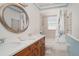 Bright bathroom with granite counters and a shower and tub combination at 1305 Greenfield Cir, Venice, FL 34292