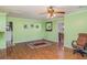 Large bonus room with laminate flooring, ample space for activities, and easy access to other areas at 1305 Greenfield Cir, Venice, FL 34292